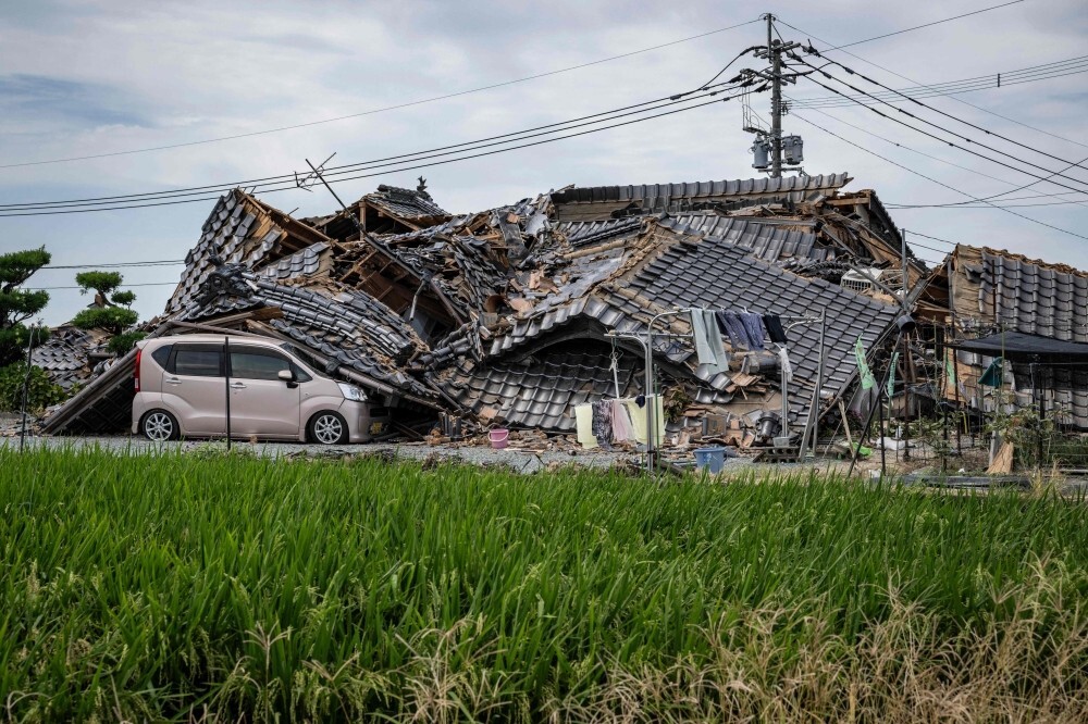 Race against heat after Japan quake leaves 30 dead and thousands without utilities