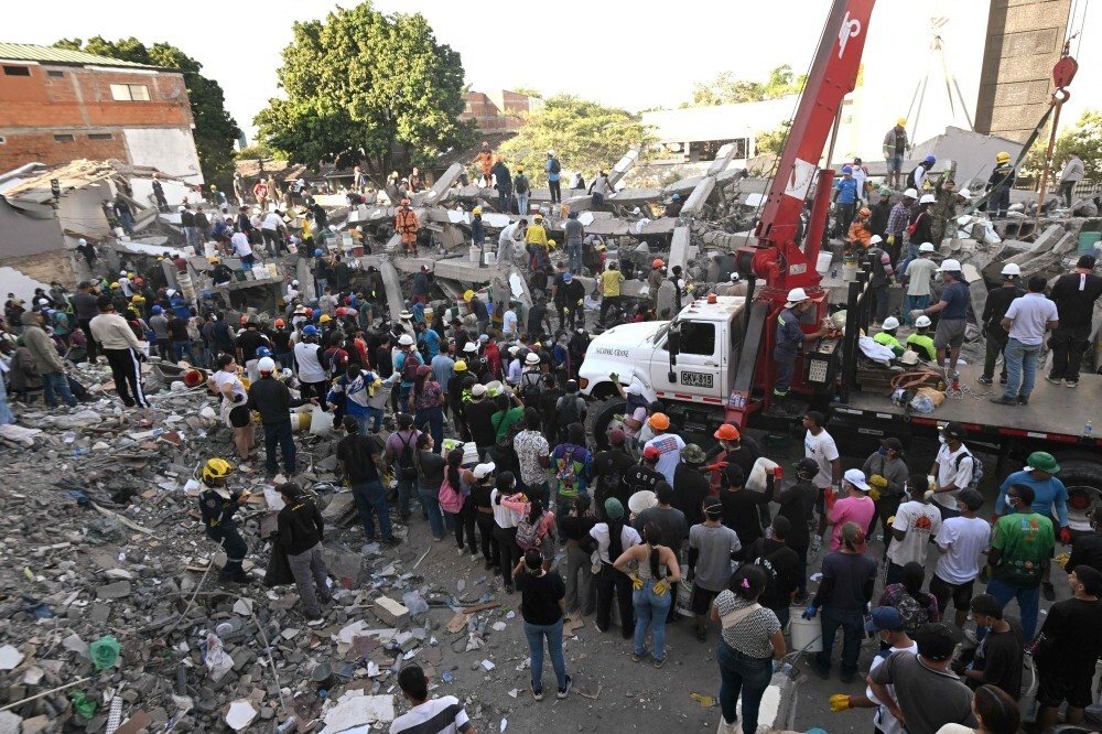 Colombian rescuers pull woman alive from quake rubble as death toll hits 216