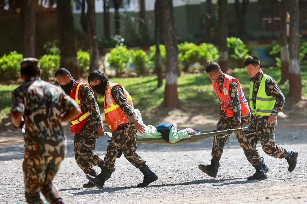 Nepal races to rescue 100 trapped in tunnel while China pauses border op as fresh floods threaten