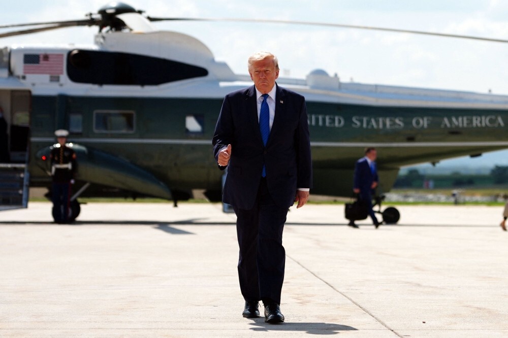 US ‘locked and loaded’ but Trump says Iran strikes on hold pending deal