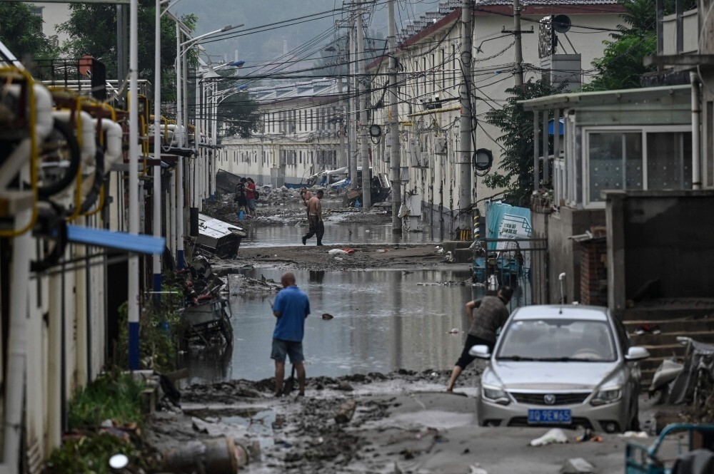 South China floods death toll jumps to 159 with 10 still missing