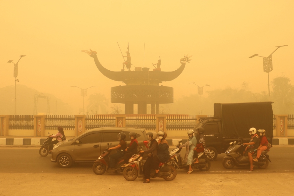 ‘What we’re breathing is poison’: Indonesia rolls out oxygen buses as wildfire haze reaches toxic levels