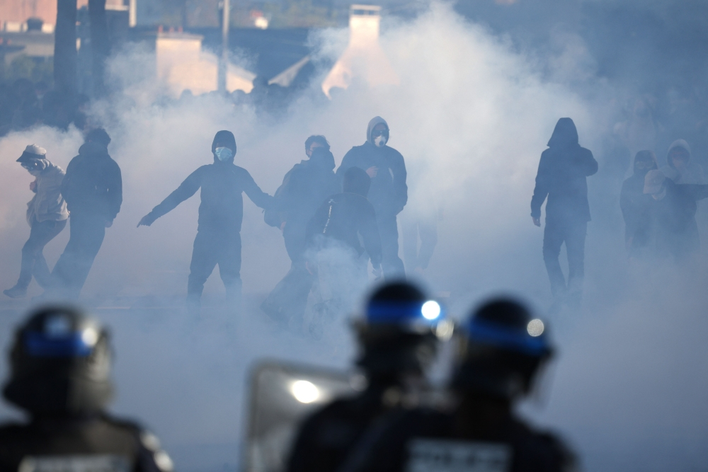 Teenager loses hand picking up grenade in France school protests