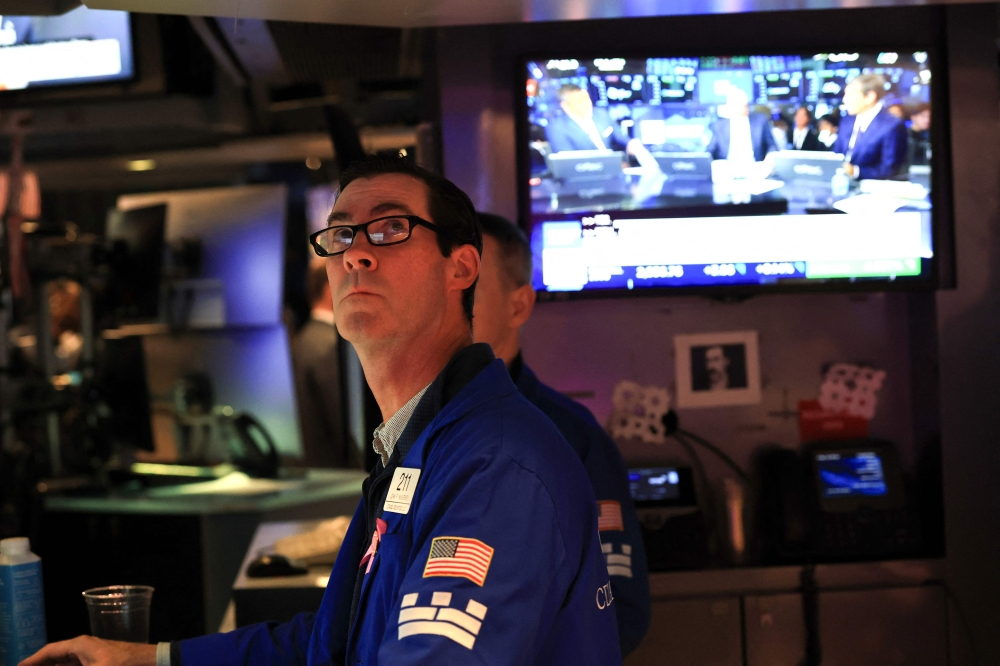 Wall Street hits fresh records as oil retreats and rate fears cool