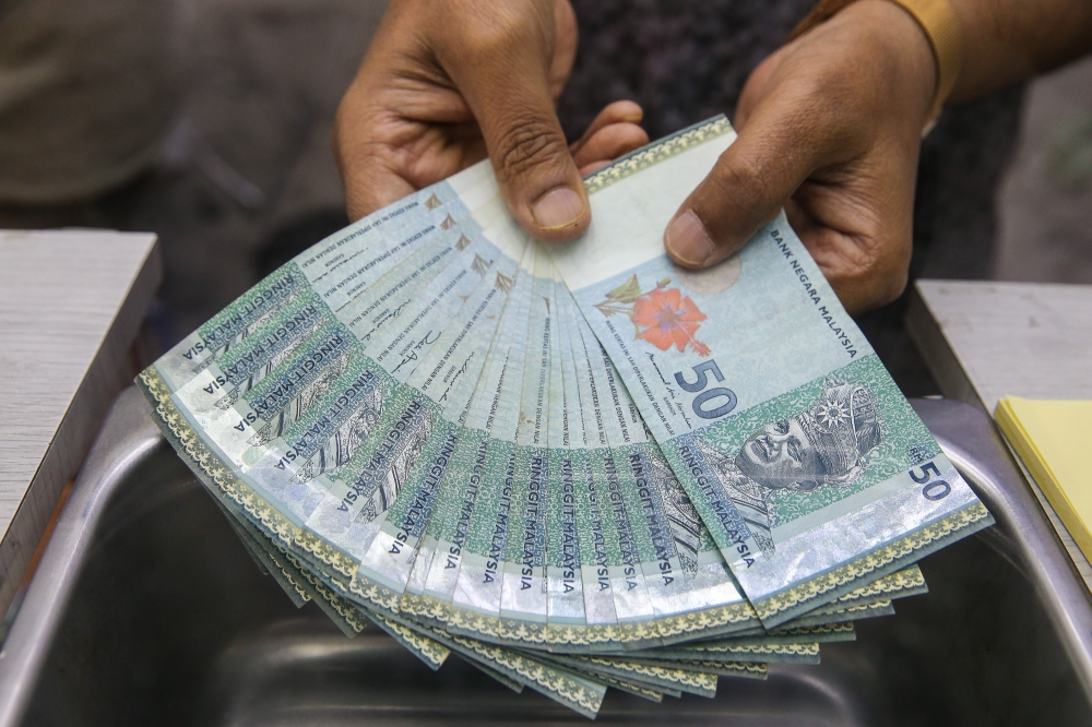 Ringgit opens slightly higher against US dollar as Fed rate outlook softens