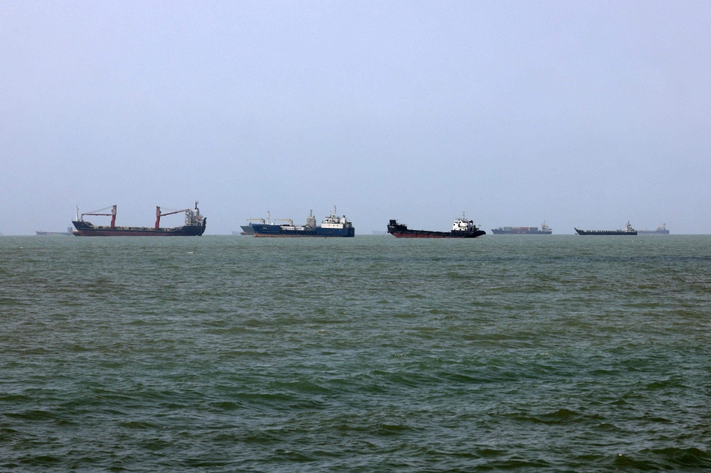 Two Singapore-registered ships hit by projectiles in Strait of Hormuz, one sinks