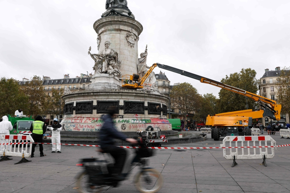 Paris bans protests as Macron accuses Trump of using unrest for US election gains
