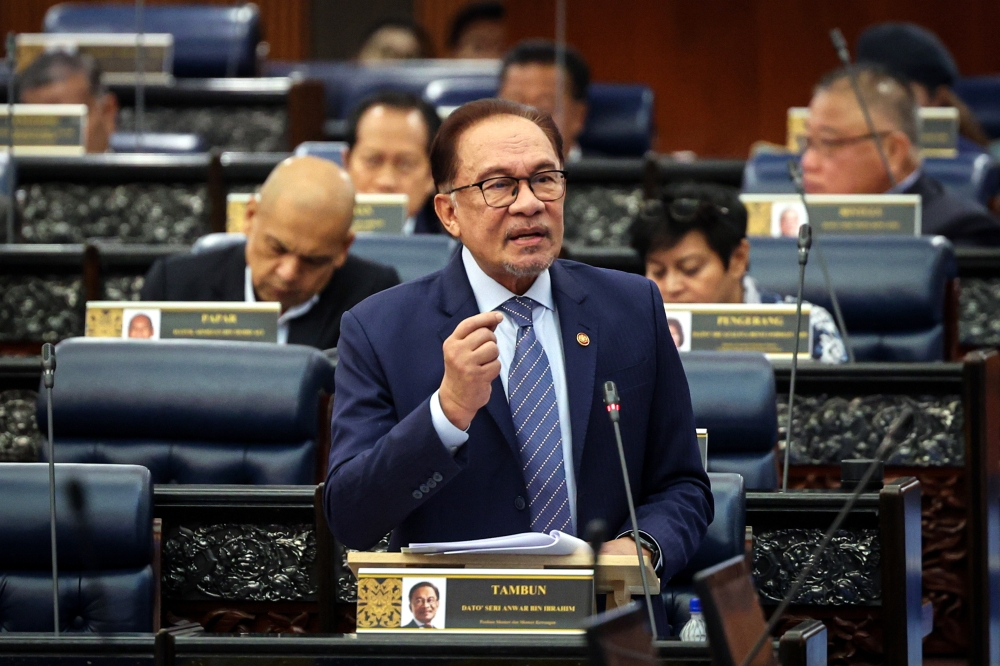 Anwar defends GLIC-funded housing, says Petronas helped develop Putrajaya